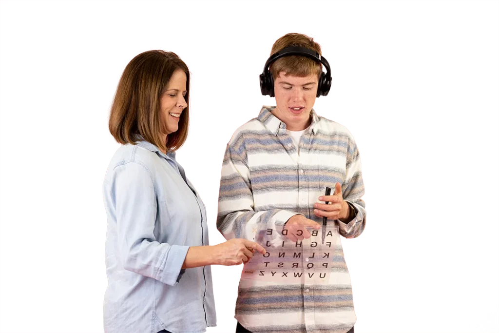 Smiling woman teaching a teenage boy