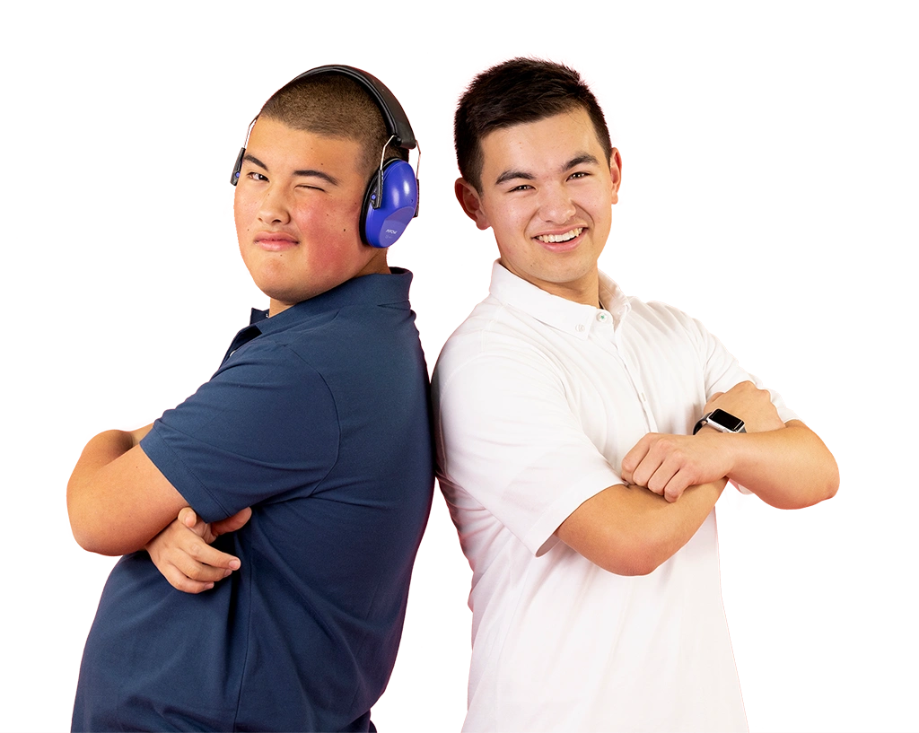 Two teenage boys posing and smiling