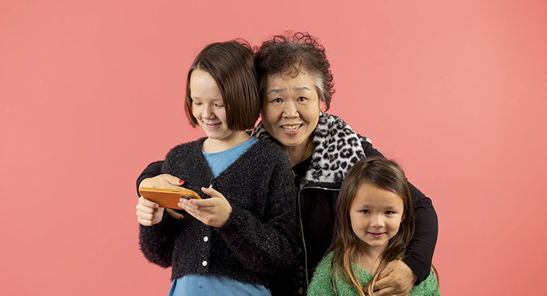 Grandmother and grandkids smiling