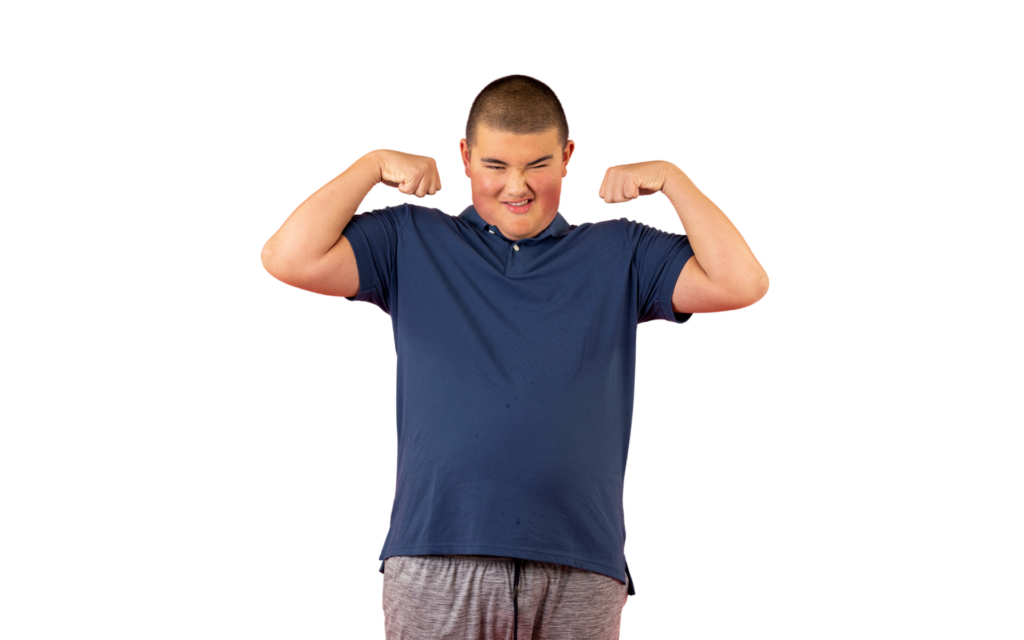 A teenager flexing his arms