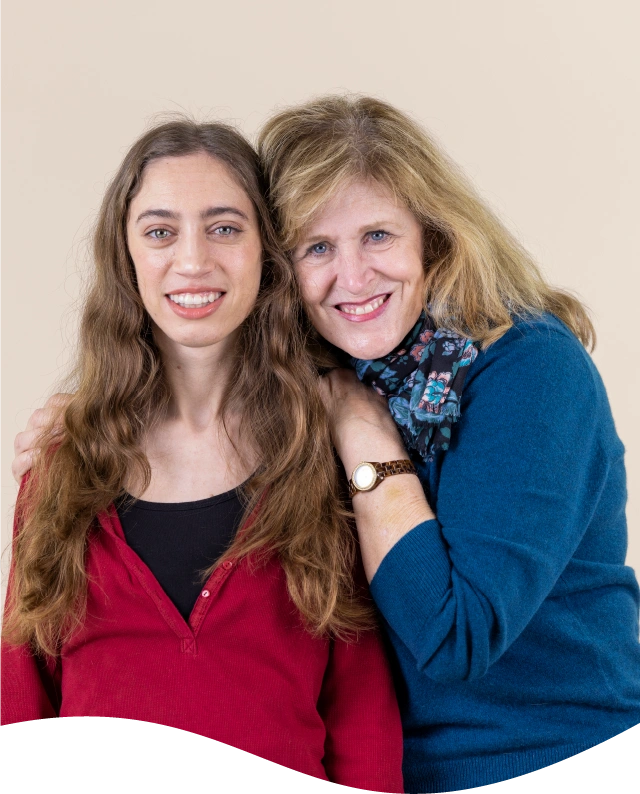 Mom and daughter smiling hugging