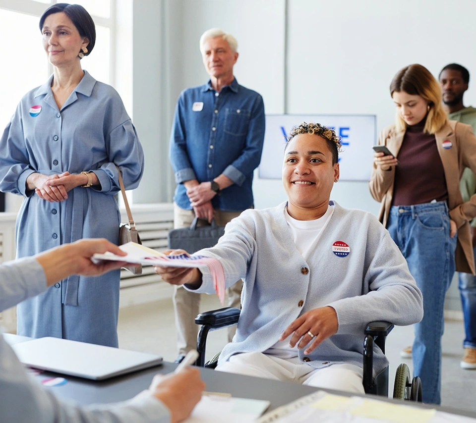 A lady on a wheelchair giving vote